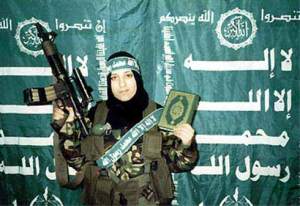 A female Hamas suicide bomber poses with the Qur'an before detonating herself and killing four Israelis.